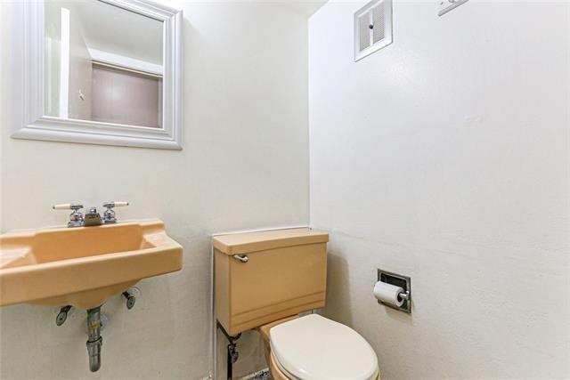 bathroom featuring visible vents and toilet