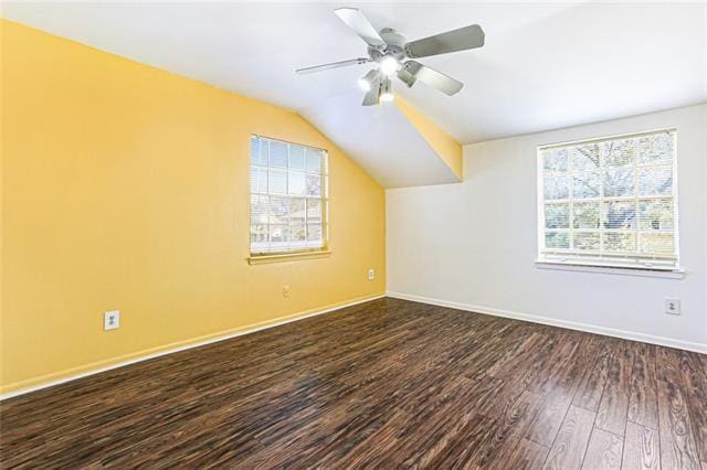 additional living space with ceiling fan, baseboards, wood finished floors, and vaulted ceiling