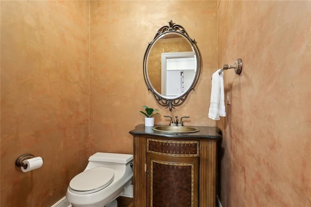 37 Spanish Fort Blvd, New Orleans, LA 70124 - half bathroom with a baseboard radiator, toilet, and vanity