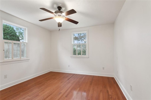 37 Spanish Fort Blvd, New Orleans, LA 70124 - unfurnished room with light wood-style flooring, a ceiling fan, and baseboards