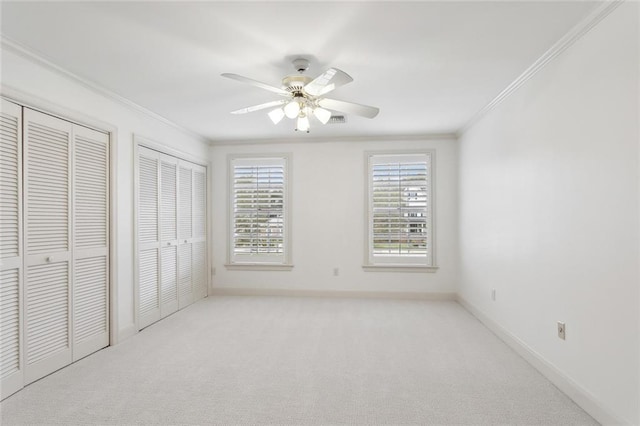 37 Spanish Fort Blvd, New Orleans, LA 70124 - unfurnished bedroom featuring baseboards, two closets, carpet floors, and ornamental molding