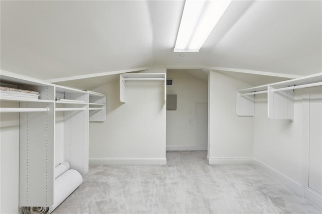 37 Spanish Fort Blvd, New Orleans, LA 70124 - walk in closet featuring visible vents, light colored carpet, and vaulted ceiling