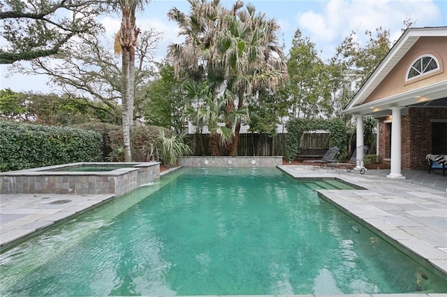 37 Spanish Fort Blvd, New Orleans, LA 70124 - view of swimming pool featuring a pool with connected hot tub, a fenced backyard, and a patio area