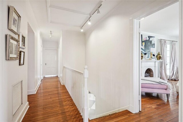 3205 Octavia St, New Orleans, LA 70125 - corridor with track lighting, hardwood / wood-style flooring, baseboards, and crown molding