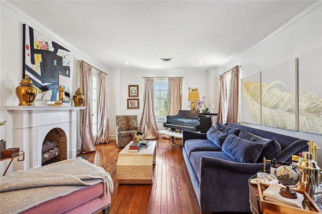 3205 Octavia St, New Orleans, LA 70125 - living room featuring ornamental molding, wood-type flooring, recessed lighting, and a fireplace