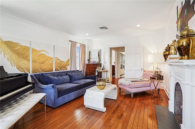 3205 Octavia St, New Orleans, LA 70125 - living room featuring wood-type flooring, crown molding, recessed lighting, and a fireplace with flush hearth