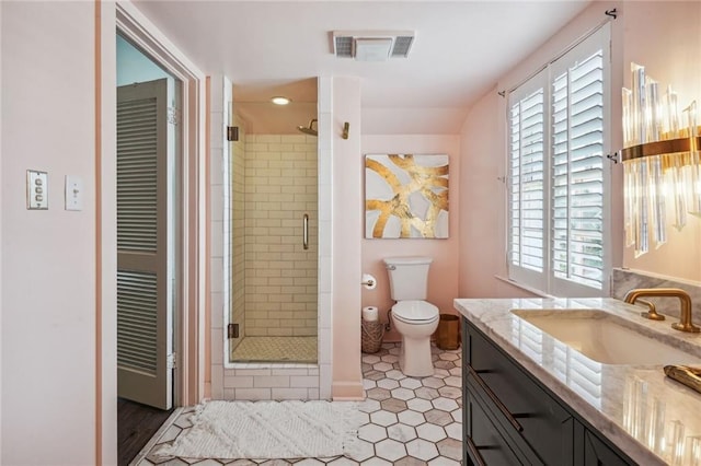 3205 Octavia St, New Orleans, LA 70125 - bathroom featuring vanity, a shower stall, and toilet