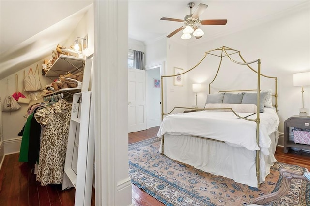 bedroom with wood finished floors and ornamental molding