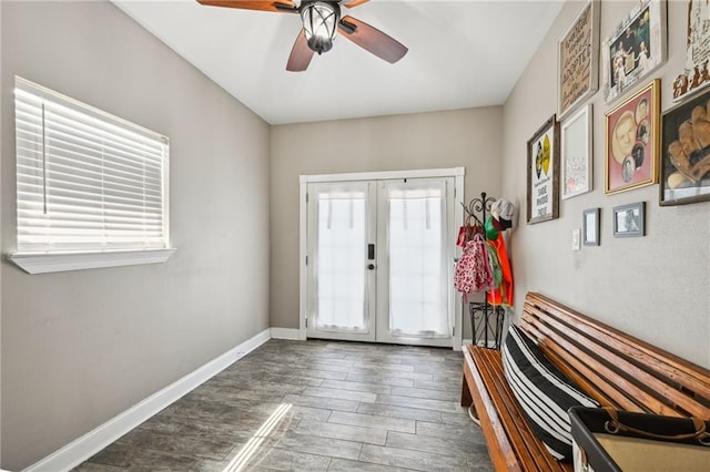 doorway with french doors, a ceiling fan, baseboards, and wood finished floors