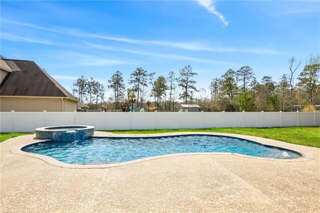 view of pool with a fenced backyard, a pool with connected hot tub, and a patio