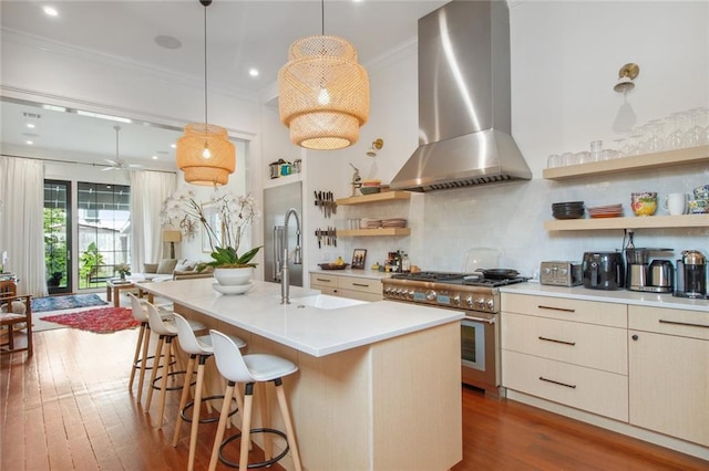 kitchen featuring double oven range, ornamental molding, dark wood-style floors, wall chimney exhaust hood, and open shelves