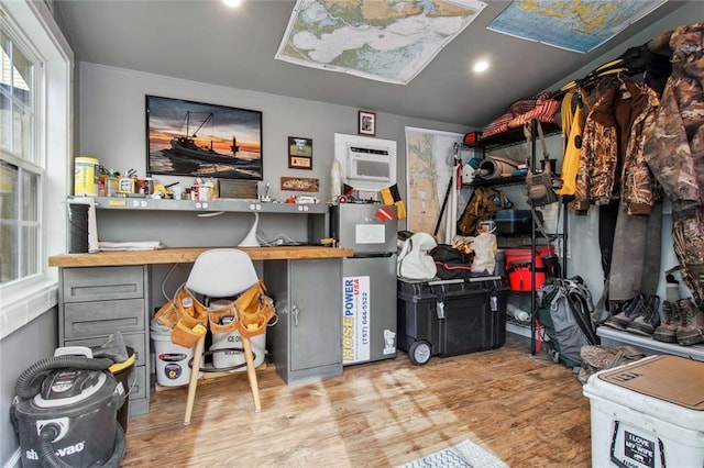 storage area with a wall mounted air conditioner