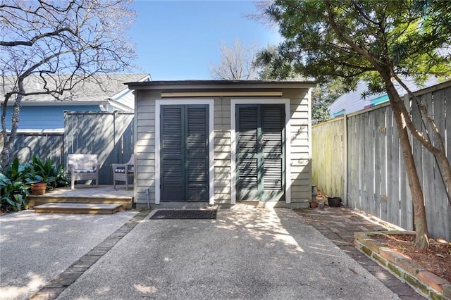 view of outdoor structure featuring a fenced backyard