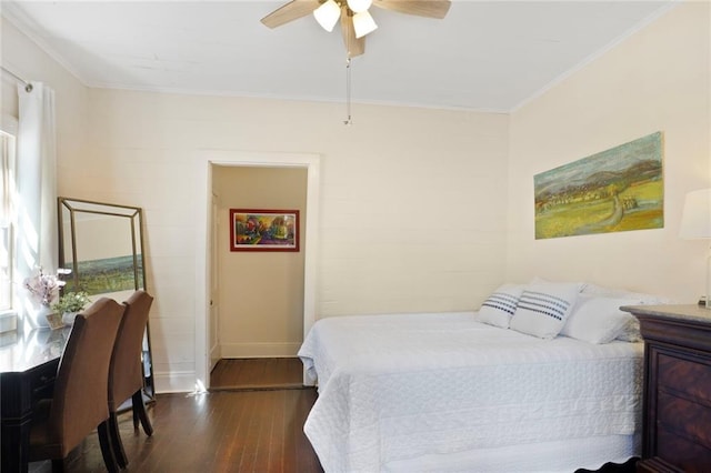 bedroom with ceiling fan, baseboards, dark wood-style floors, and ornamental molding