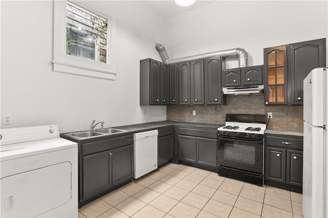 kitchen with white appliances, washer / dryer, a sink, exhaust hood, and backsplash