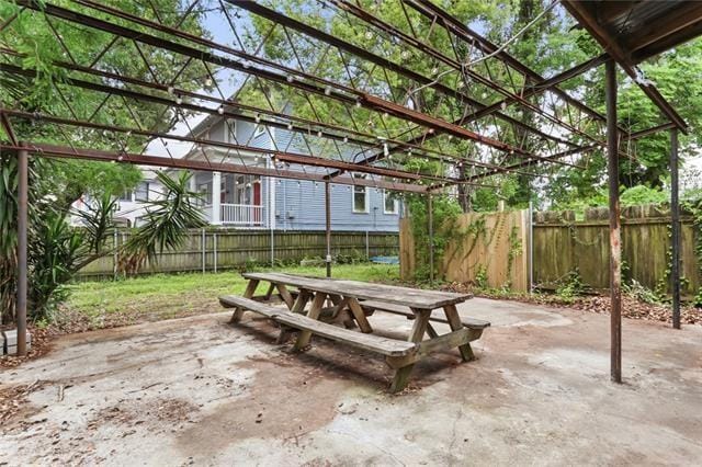 view of patio featuring a fenced backyard and a pergola