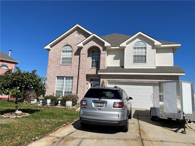 traditional-style home featuring brick siding, driveway, a garage, and roof with shingles