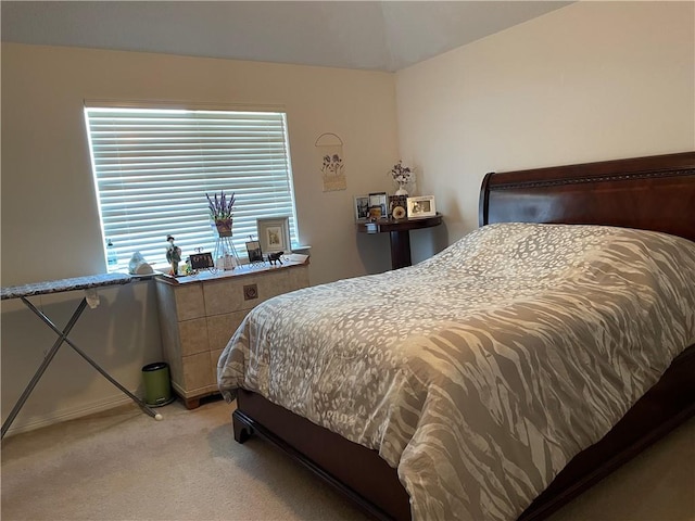 bedroom with light colored carpet