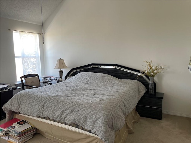 bedroom featuring baseboards, a textured ceiling, carpet, and vaulted ceiling