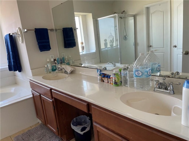 full bath featuring a bath, a stall shower, double vanity, and a sink