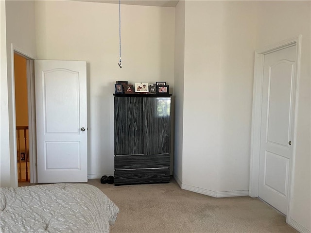 carpeted bedroom with baseboards