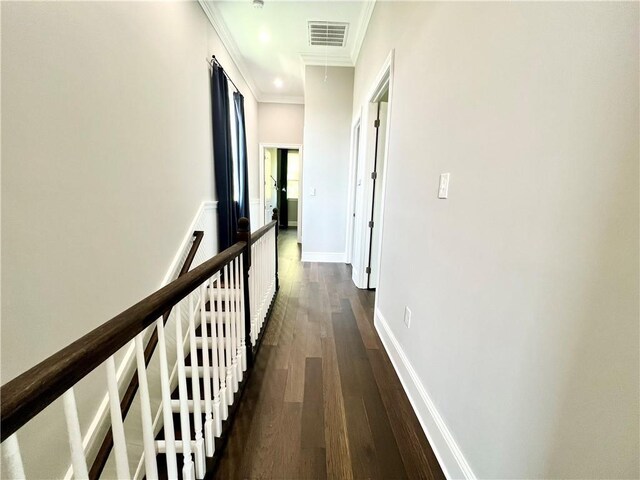 hallway with visible vents, crown molding, dark wood-style flooring, baseboards, and recessed lighting