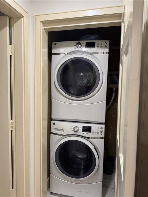 laundry area with laundry area and stacked washing maching and dryer