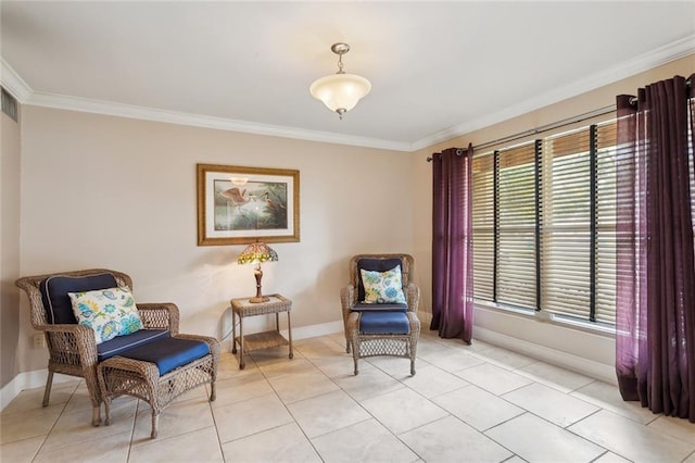 sitting room featuring light tile patterned floors, baseboards, plenty of natural light, and ornamental molding