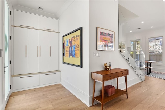 interior space featuring visible vents, recessed lighting, baseboards, and light wood finished floors