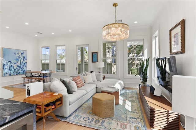 living room featuring a wealth of natural light, light wood-style flooring, and recessed lighting