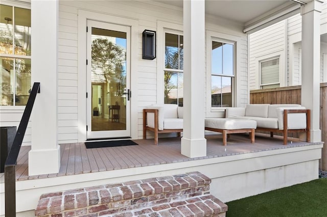 doorway to property with covered porch and an outdoor hangout area