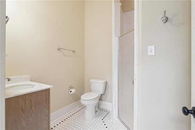 full bath with a shower stall, baseboards, toilet, tile patterned floors, and vanity