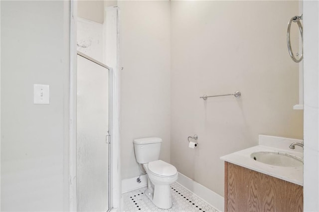 full bathroom with a shower stall, baseboards, toilet, tile patterned floors, and vanity