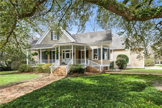 view of front of home with covered porch and a front lawn