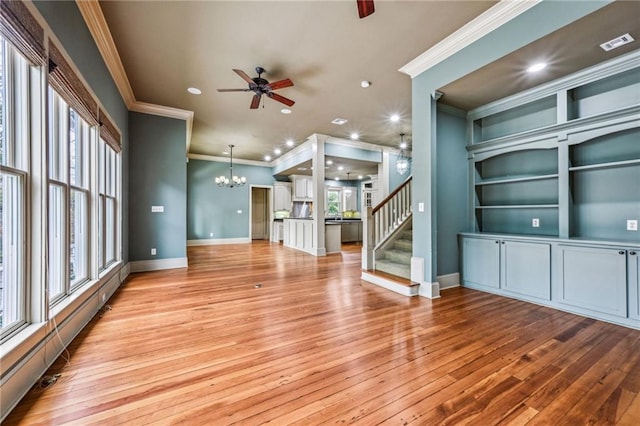 unfurnished living room with visible vents, baseboards, stairs, light wood-style flooring, and ceiling fan with notable chandelier