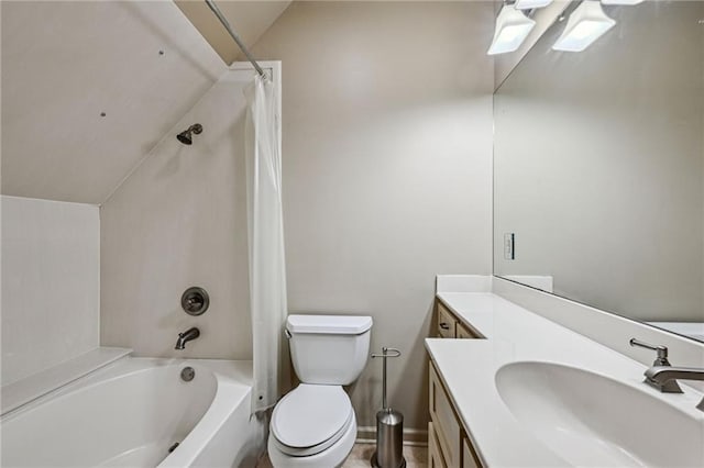 bathroom featuring vanity, baseboards, lofted ceiling, shower / bath combination with curtain, and toilet