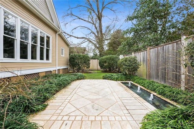 view of patio with a fenced backyard