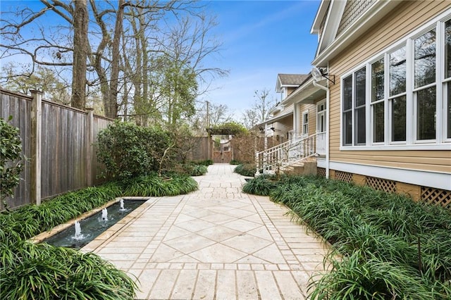 view of patio with a fenced backyard