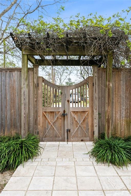 view of gate with fence