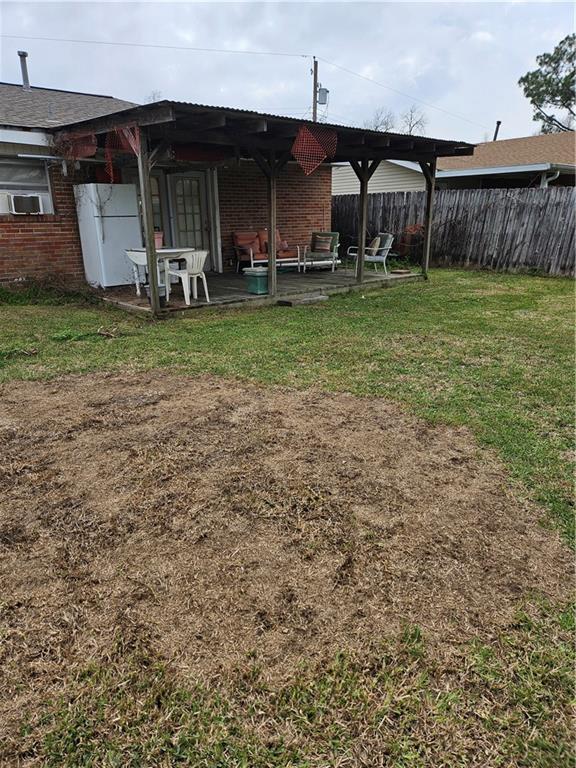 view of yard featuring a patio area and fence