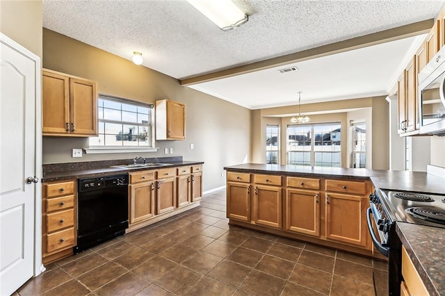 kitchen with black appliances, a sink, dark countertops, a textured ceiling, and a peninsula