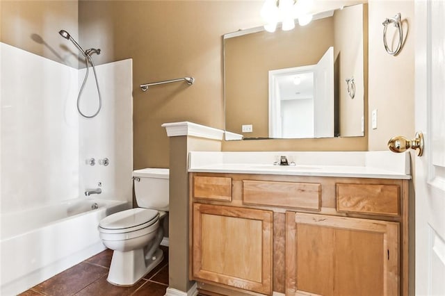 bathroom with vanity, tile patterned floors, toilet, and bathing tub / shower combination