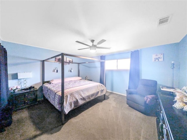 bedroom featuring a ceiling fan, visible vents, and baseboards