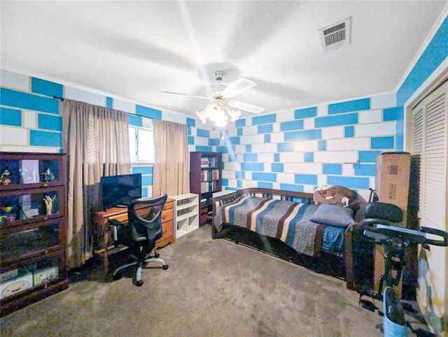 bedroom with a ceiling fan, visible vents, carpet floors, wallpapered walls, and a closet