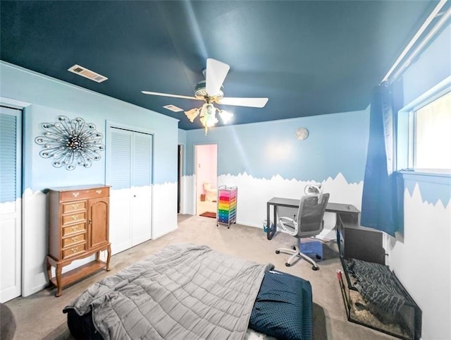 bedroom featuring visible vents, carpet flooring, and a ceiling fan