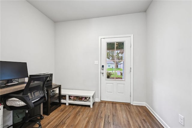 office area featuring baseboards and wood finished floors