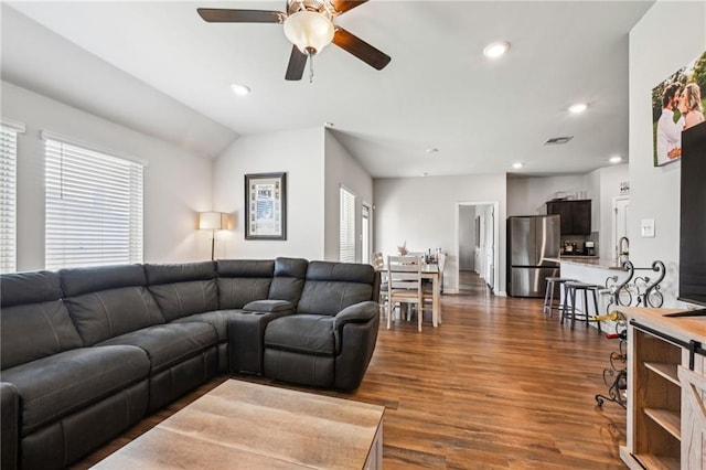 living area featuring dark wood-style floors, recessed lighting, and a healthy amount of sunlight