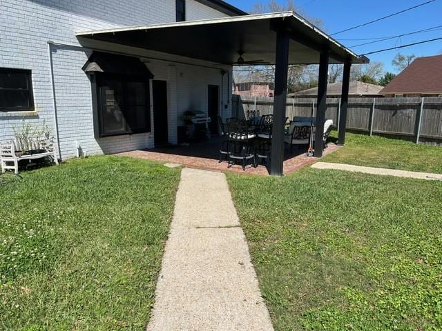 exterior space featuring a patio and fence