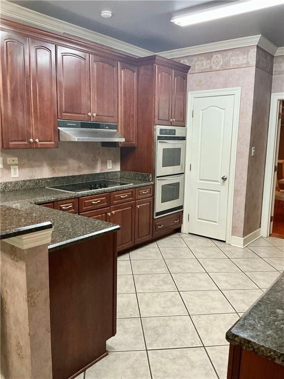 kitchen featuring stainless steel double oven, a peninsula, ornamental molding, under cabinet range hood, and black electric cooktop