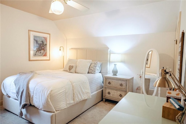 bedroom with light carpet and vaulted ceiling